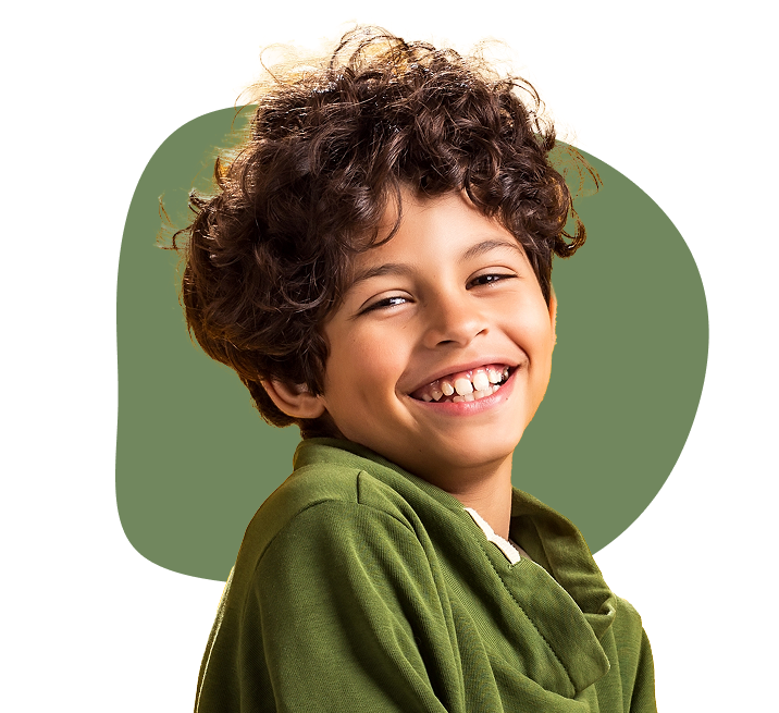 Green circle with a brown curly haired boy smiling wearing a green shirt
