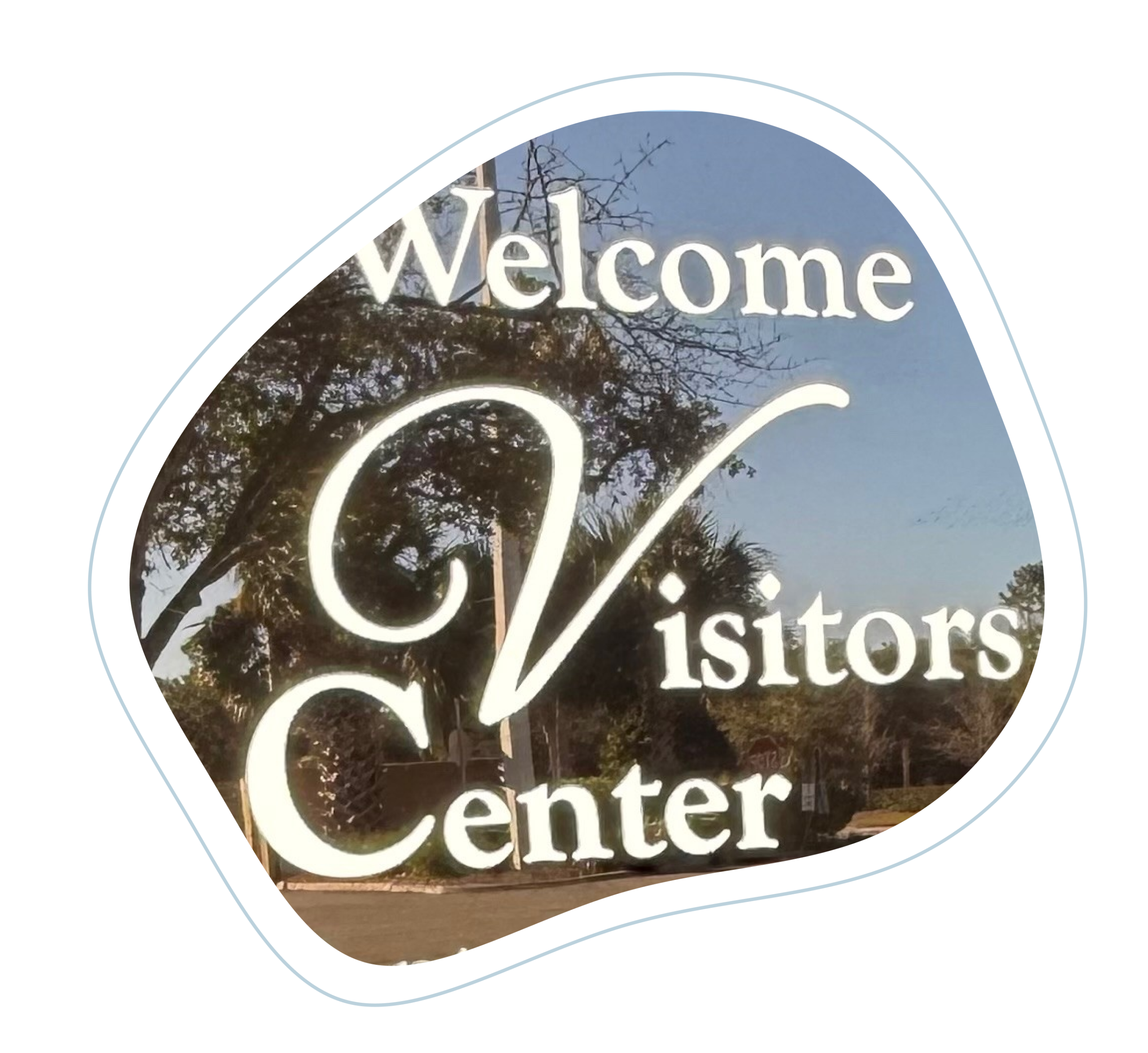 Welcome sign that reads Welcome Visitors Center Ponte Vedra Beach with trees and pavement of the parking lot in the background in Ponte Vedra Beach, FL.