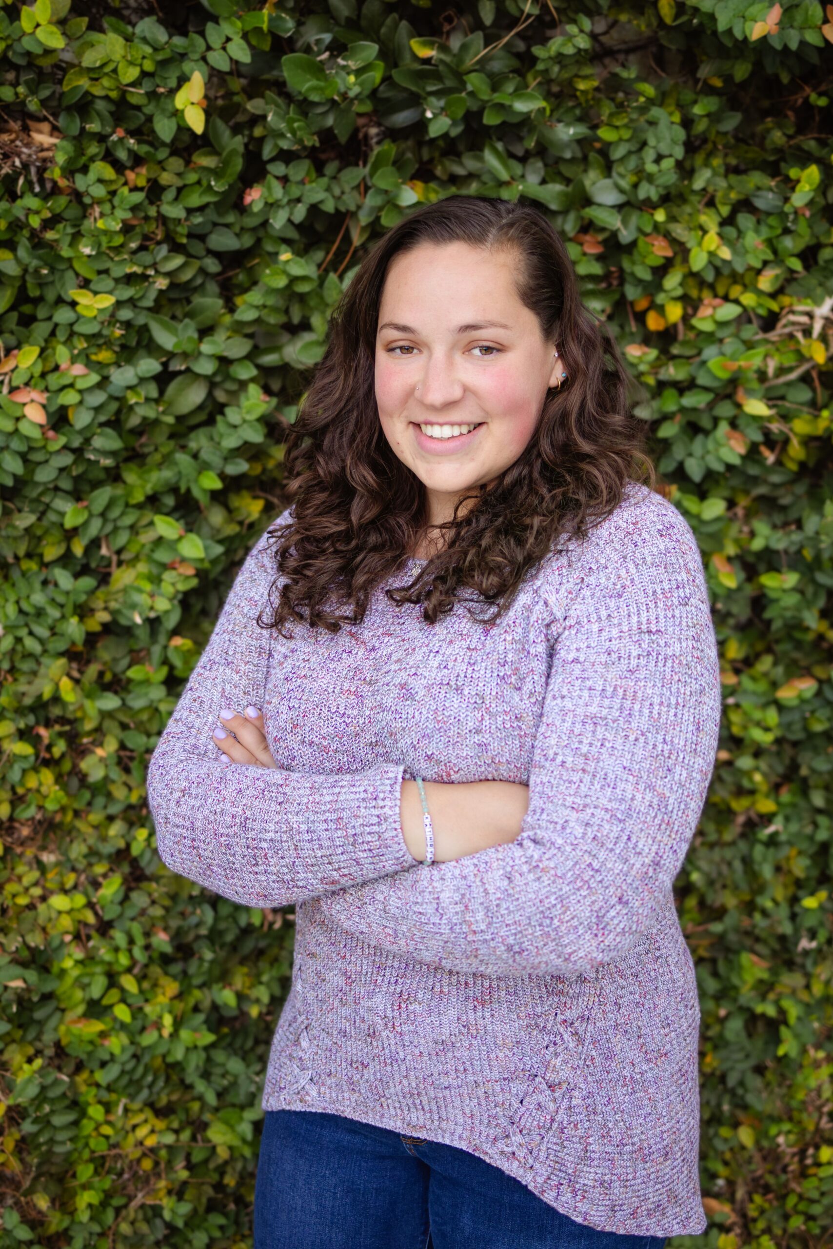 _Kat, waist up, arms crossed, smiling, in a light purple long-sleeved sweater, in San Marco, Jacksonville, FL